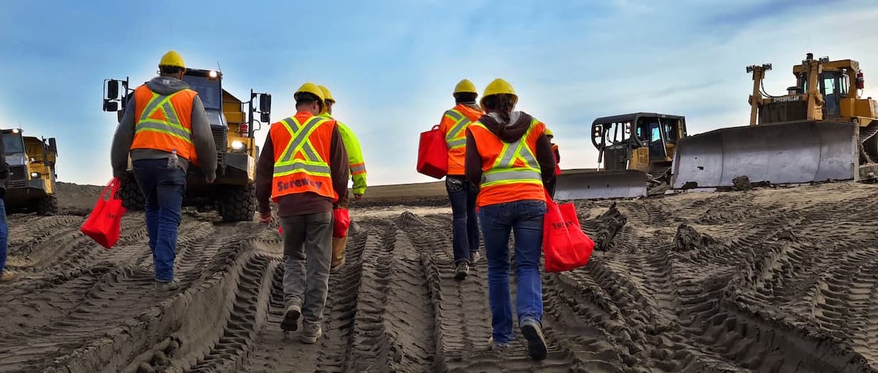 workers walking uphill